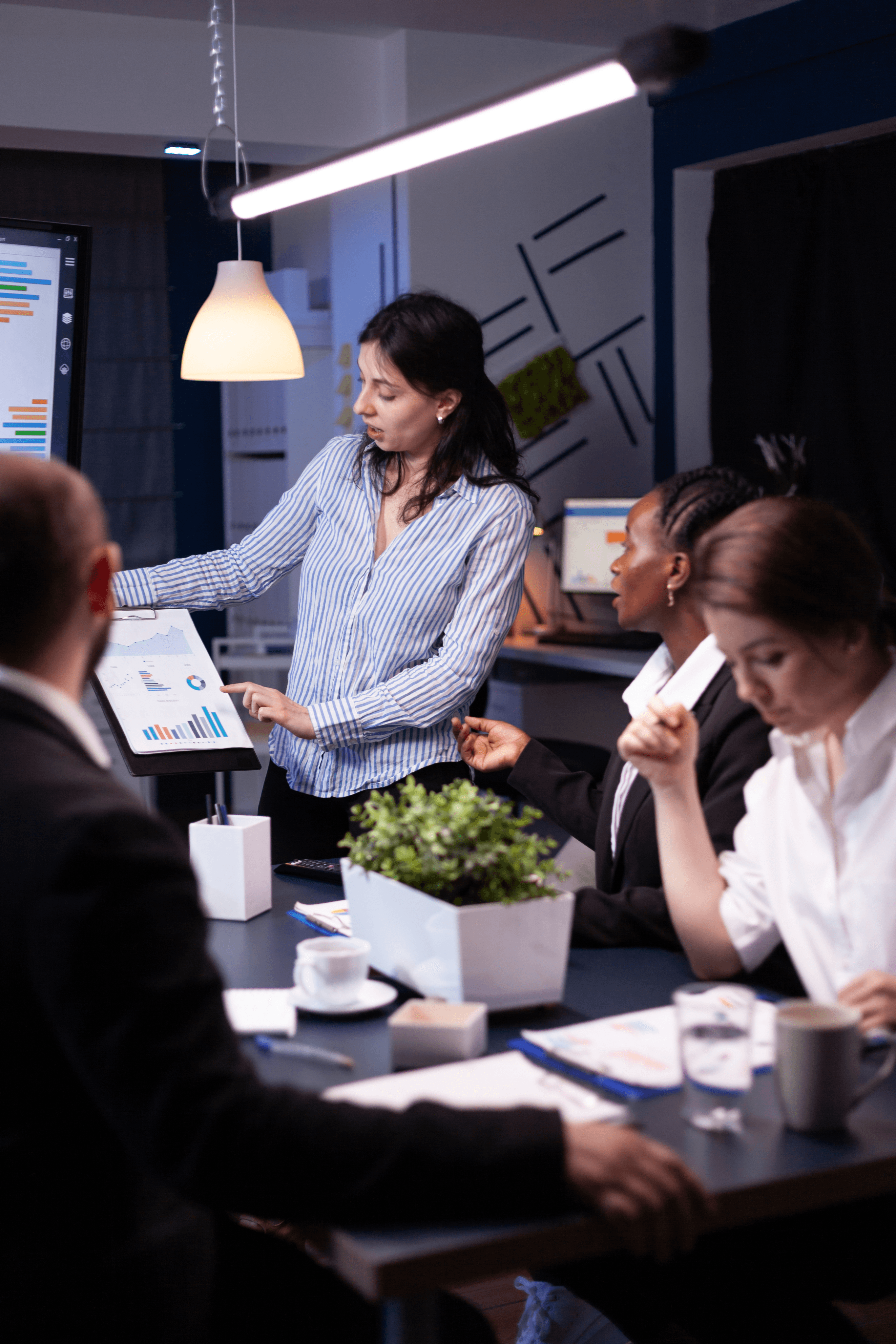 Facilitator leading a workshop with participants seated around a table