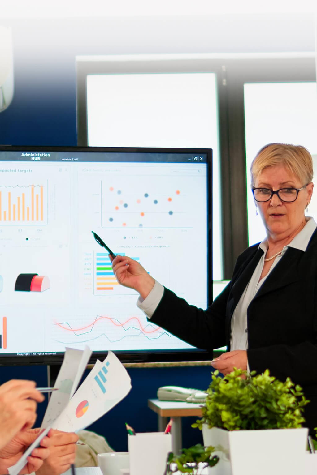 Team applauding around a boardroom table during a strategy session